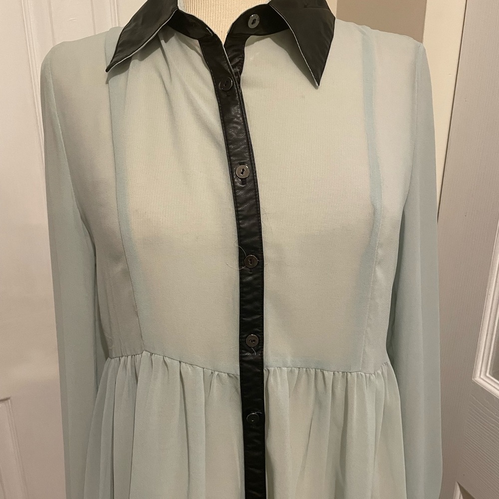 Faux leather trim long sleeve blouse with a lace back